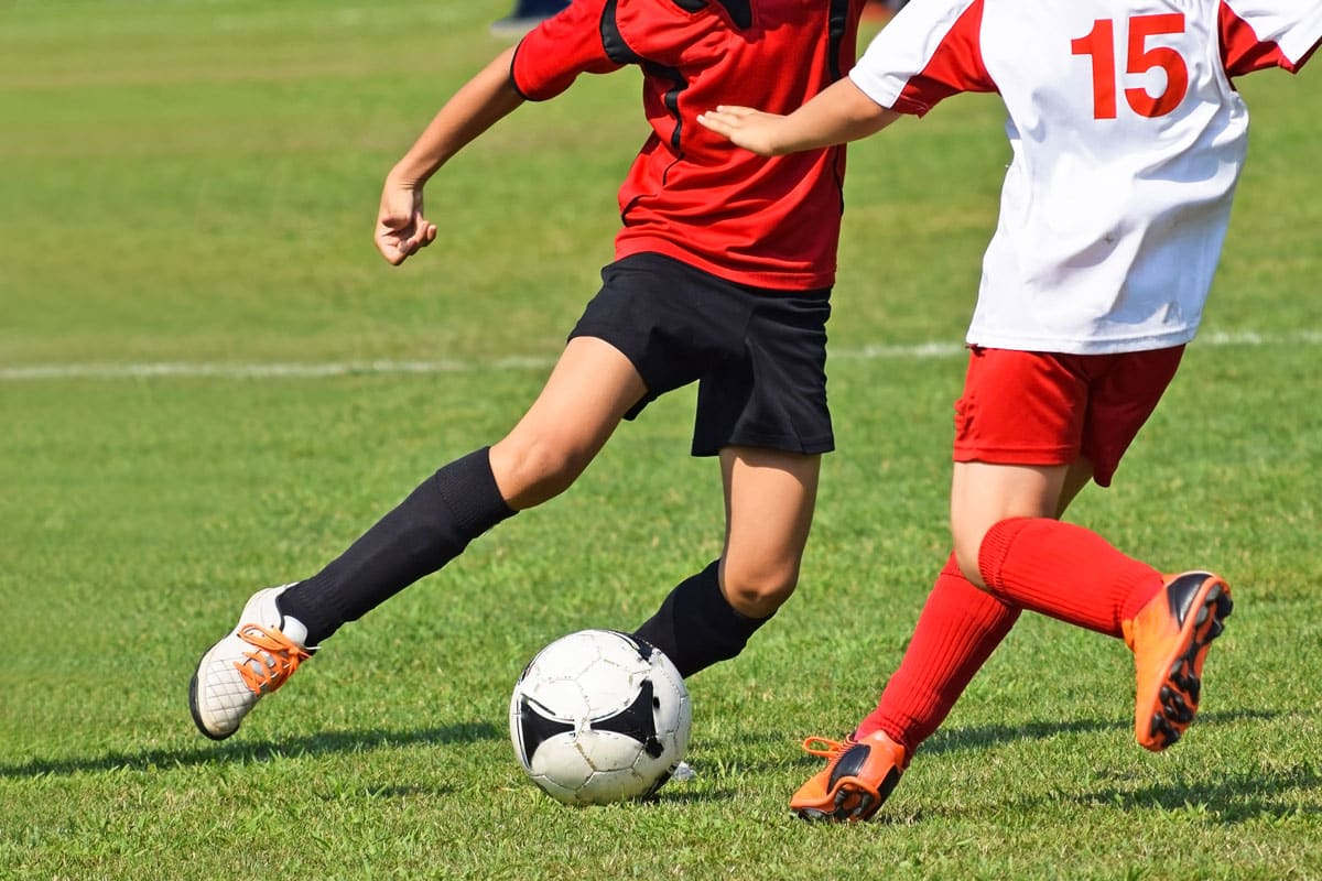 two-men-playing-soccer